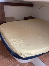 Cozy cabin interior of 2013 Rio Yachts Rio 36 with a neatly made bed.