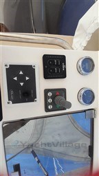 Control panel of a 2013 Rio Yachts Rio 36, featuring gauges and switches.