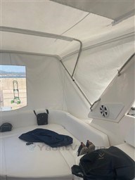 Interior of 2013 Rio Yachts Rio 36 with white seating and speaker.