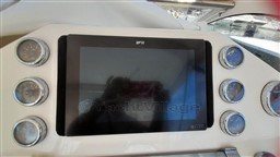 Control panel of 2013 Rio Yachts Rio 36 with gauges and display screen.