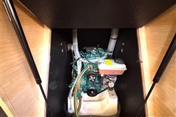 Engine compartment of 2024 Dufour 37 sailboat, showcasing mechanical components.
