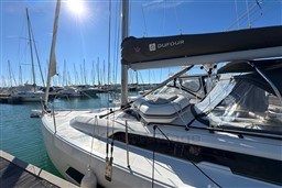 2024 Dufour 37 sailboat docked in a sunny marina, showcasing sleek design.