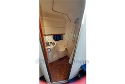 Bathroom interior of 2002 Cranchi Smeraldo 37 yacht, featuring sink and shower.