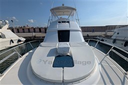 2005 Tiara Yachts 3900 Convertible docked at marina, sunny day, clear sky.