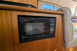 Tappan microwave in 2005 Tiara Yachts 3900 Convertible interior, wooden cabinetry.