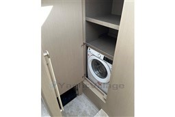Laundry area with washing machine in 2022 Azimut AZIMUT 68 FLY yacht.