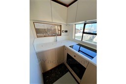 Modern kitchen interior of 2022 Azimut AZIMUT 68 FLY yacht with sleek design and appliances.