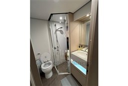 Modern bathroom in 2022 Azimut 68 Fly yacht with shower, toilet, and sink.