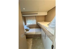 Interior cabin of 2022 Azimut 68 Fly yacht with bunk beds and modern design.