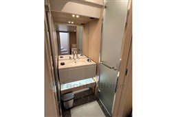 Luxurious bathroom in 2022 Azimut 68 Fly yacht with modern fixtures and sleek design.
