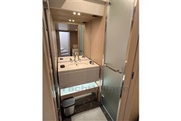 Luxurious bathroom in 2022 Azimut 68 Fly yacht with modern fixtures and elegant design.