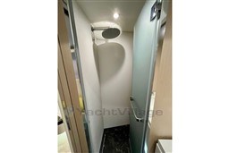 Shower area in 2022 Azimut AZIMUT 68 FLY yacht, featuring modern fixtures and frosted glass door.