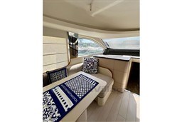 Luxurious interior of 2022 Azimut 68 Fly yacht with elegant seating and nautical decor.