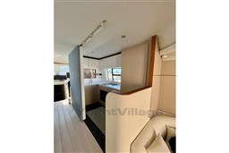 Modern kitchen interior of 2022 Azimut 68 Fly yacht, featuring sleek design and ample lighting.