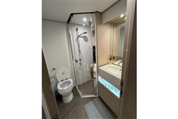 Modern bathroom on 2022 Azimut 68 Fly yacht with shower, toilet, and sink.