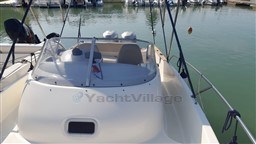 2008 Jeanneau Cap Camarat 755 WA boat docked in a marina.