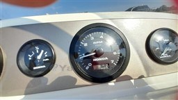 Dashboard of a 2008 Jeanneau Cap Camarat 755 WA boat with Honda gauges.