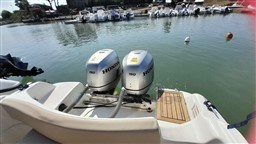 2008 Jeanneau Cap Camarat 755 WA with twin Honda 150 engines docked in marina.