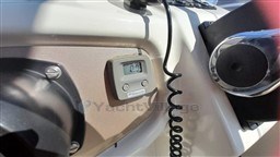 Control panel of 2008 Jeanneau Cap Camarat 755 WA boat, featuring digital display and controls.