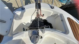 Anchor compartment of 2008 Jeanneau Cap Camarat 755 WA boat with chain and winch.