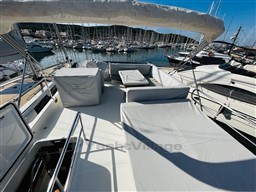 2019 Cranchi ECO Trawler 43 Long Distance yacht docked at marina, featuring spacious deck.