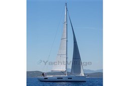 2024 Solaris 50 sailboat cruising on open water under clear blue skies.