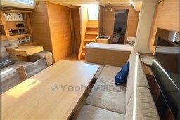 Luxurious interior of 2024 Solaris 50 yacht with modern furnishings and natural wood finish.
