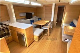 Luxurious interior of 2024 Solaris 50 yacht with modern kitchen and dining area.