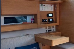 Interior of 2024 Solaris 50 yacht with modern wood finish and control panel.