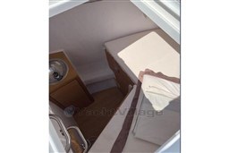 2024 Solaris 50 yacht interior cabin with bed and sink, featuring modern design.