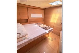 Luxurious cabin interior of 2024 Solaris 50 yacht with natural wood finish.