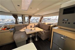 Interior of 2024 Fountaine Pajot Isla 40 catamaran with modern seating and dining area.