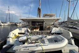 2024 Fountaine Pajot Isla 40 catamaran docked with inflatable boat and Selva motor.