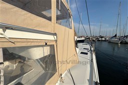2024 Fountaine Pajot Isla 40 catamaran docked in a marina under clear skies.