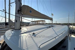 2024 Fountaine Pajot Isla 40 catamaran docked, showcasing sleek deck and sail details.