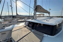 2024 Fountaine Pajot Isla 40 catamaran docked, featuring sunlit deck and sails.