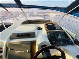 Helm of 2005 Innovazione e Progetti Mira 43 yacht with Raymarine navigation system.