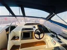 2005 Innovazione e Progetti Mira 43 yacht cockpit with modern navigation equipment.