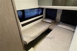 2020 Azimut S6 yacht cabin with twin beds and modern interior design.