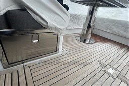 2020 Azimut S6 yacht interior with sleek wood flooring and modern stainless steel accents.