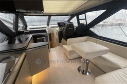 Luxurious interior of a 2020 Azimut S6 yacht with modern seating and helm.