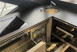 Modern kitchen area in a 2020 Azimut S6 yacht with sleek appliances and sink.