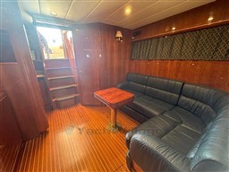 Luxurious interior of 2000 Rizzardi CR 53 Top Line yacht with leather seating and wooden flooring.