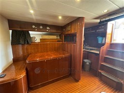 Luxurious interior of 2000 Rizzardi CR 53 Top Line yacht with wooden cabinetry and stairs.