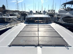 Luxury 2000 Rizzardi CR 53 Top Line yacht docked in marina, surrounded by other boats.
