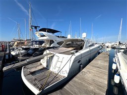 2000 Rizzardi CR 53 Top Line yacht docked at marina under clear blue sky.