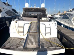 2000 Rizzardi CR 53 Top Line yacht docked at marina, rear view with boarding ramp.