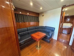 Luxurious interior of 2000 Rizzardi CR 53 Top Line yacht with leather seating and wooden accents.