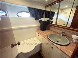 Bathroom interior of 2000 Rizzardi CR 53 Top Line yacht with sink and mirror.