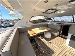 Luxurious 2000 Rizzardi CR 53 Top Line yacht interior with elegant seating and wooden table.
